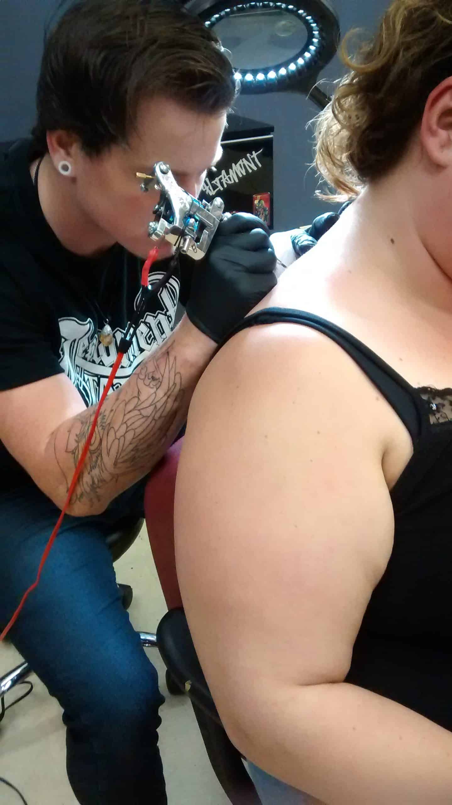 The guy who just did her neck tattoo looks like an unprofessional artist!  Why would she get it on her neck!!! Smoking inside the tattoo shop!?? I'd  never go to him and